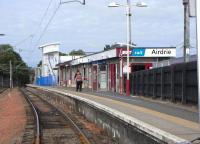 View over the buffers along bay Platform 1 at Airdrie on 14 August. <br>
This platform is to be retained when Airdrie gets full through running on the (re)opening of the second through platform in December. I believe only every other through service from Edinburgh will serve stations between here and Glasgow, so to maintain the four per hour stopping service on this stretch there will have to be trains originating from Airdrie. Could they be going to Milngavie, to replace the services currently originating from Bellgrove? Let's see.<br><br>[David Panton 14/08/2010]