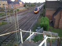 The former village station of Bulkington lies South of Nuneaton and East of Bedworth. The station building is fine, the steps from the road bridge are fine, but I'm not convinced that the LNWR used white painted scaffolding poles as handrails...notice the new flats for trainspotters on the left. View looks South.<br><br>[Ken Strachan 10/08/2010]