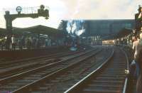 Large crowds turn out at Carlisle station on 11 August 1968 to see the BR <I>Fifteen Guinea Special</I>, billed as <I>the final main line passenger train to be hauled by a steam locomotive on British Rail</I> (the BR main line 'steam ban' came into force the following day). The special had arrived from Liverpool & Manchester via the S&C hauled by 70013 <I>Oliver Cromwell</I> [see image 26044] and at this point was being made ready for the return journey behind Black Fives 44781+44871.<br><br>[Bruce McCartney 11/08/1968]