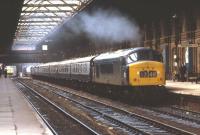 45117 in charge of a down football special] passing through Leicester Midland station on Saturday 5 April 1975. The train is taking Fulham fans to Sheffield for the FA Cup Semi-Final against Birmingham City at Hillsborough, a hard-fought 1-1 draw. [Fulham won the replay only to lose 2-0 in the final to London rivals West Ham United] <br><br>[Bill Jamieson  0/04/1975]