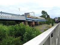 View east across the River Kelvin on 23 June with an EMU held at signals on the Kelvinhaugh Viaduct.<br><br>[Alistair MacKenzie 23/06/2010]