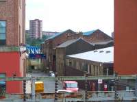 View from Newcastle Central along South Street on 16 August 2010, showing part of Robert Stephenson's former Forth Banks works, with a section of the QEII Metro bridge seen crossing the Tyne in the background.  What was the world's first purpose built locomotive works opened here in 1823, in connection with the construction of the Stockton and Darlington Railway. Locomotives built here included Locomotion and Rocket, with the works going on to become a worldwide exporter. Forth Banks works finally closed in 1960, but the office block and one of the worshops was subsequently restored by the Robert Stephenson Trust.<br>
<br><br>[Colin Alexander 16/08/2010]