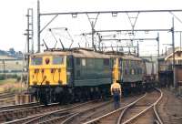 E26029 and E26016 pass Wombwell Main Junction with a Wath Yard to Fiddlers Ferry Power Station MGR coal train in July 1971. There would have been another pair of class 76s assisting in the rear for the ascent of Worsborough Bank.<br>
<br><br>[Bill Jamieson 21/07/1971]