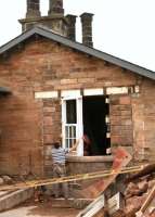 Update on the continuing refurbishment work on the station building at Sanquhar, seen here in July 2010 [see image 28961]. The photograph shows work in progress on the new living room bay window.<br><br>[Peter Rushton /07/2010]