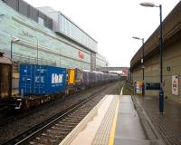 The first of the new ScotRail emus, unit 380106, seen here just after passing the northbound platform at Shepherd's Bush station on the West London Line on 25 August 2010 as part of a Dollands Moor - Wembley freight.<br><br>[Michael Gibb 25/08/2010]