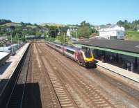 A Penzance to Edinburgh service, formed by a Cross Country Super Voyager, calls at Totnes in this view westwards from the station footbridge. There are still two through roads at Totnes, in addition to the two platform lines, allowing overtaking between Plymouth and Newton Abbott and also giving freights a run at the steep banks that lie either side of the station. <br><br>[Mark Bartlett 17/06/2010]