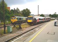 A busy Saturday afternoon at Leicester on 5 June 2010, with a 170 stabled in the siding and a Freightliner class 66-5 with a train of Castle Cement tanks [probably for Ketton - see image 51841] standing in the loop.<br><br>[Ken Strachan 05/06/2010]