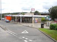 Rail was not seen as the future at the time New Towns were planned <br>
and as a result their stations are not always conveniently placed. <br>
Cumbernauld station, seen here in August 2010, is on the south-eastern edge of the sprawling town and that taxi rank and bus stop are essential.It was (and is) 2 miles from the original Cumbernauld village - so it's perhaps surprising that it ever had a station in the first place.<br>
<br><br>[David Panton 14/08/2010]