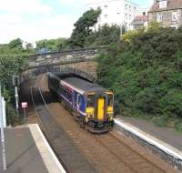 A 156 in Fife? It can only be a Sunday, when the stock is released <br>
from the Shotts line.  156 465 pulls into Burntisland station on 29 August, drowning out the competing bells of the Kirk and the Free Kirk.  The Hill Street roadbridge is on quite a steep gradient for a bridge, creating a bit of an optical illusion: an impression of a skew which, on a closer look, isn't there.  <br>
<br><br>[David Panton 29/08/2010]