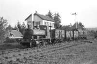 Barclay 0-4-0ST No 1 <i>Dailuaine</i> with three ex-Aberdeen Gas Board coal wagons and two tank wagons alongside Boat of Garten North signal cabin on 15 June 1974.<br>
<br><br>[John McIntyre 15/06/1974]