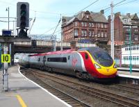 A Glasgow - London Pendolino service runs under Victoria Viaduct and into Carlisle station on 3 June 2010.<br><br>[Colin Miller 03/06/2010]