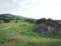 The Carnforth Ironworks tramroad has been closed for at least 80 years but large parts of the old formation can still be seen. Here a section of embankment has been <I>grubbbed out</I> to afford access to the river bank but the old line can be seen stretching away northeastwards towards the point where it crosses the Furness main line and to the old quarry beyond. Map Reference SD 486714<br><br>[Mark Bartlett 27/08/2010]