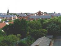 View over the site of the former 1847 Newcastle and North Shields Railway terminus at Tynemouth, photographed in the summer of 2010. Part of Tynemouth Priory can be seen on the skyline in the right background. The current (NER) through station stands off picture to the left. [See image 21750 for the scene twenty-six years earlier].<br><br>[Colin Alexander 18/08/2010]