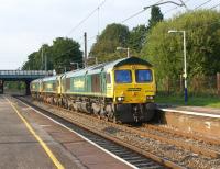 <I>Three little MAIDSsssss...  from Crewe!</I>  ...diddy dah - diddy dah - diddy dah - diddy dah - etc.. etc....</I> (with apologies to WS Gilbert).  A trio of Freightliner Class 66s en route from Carlisle to Crewe. 66596, 66507 and 66606 photographed heading south through Leyland station on 3 September 2010. <br><br>[John McIntyre 03/09/2010]