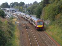 So long as the SPT livery survives (and two years on from the <br>
introduction of a unified livery no Class 170 has been painted out of it) the Fife Circle will continue to look some days like a detached portion of the SPT network, with maroon units forming train after train.  On 4 September 170 472 pulls away from Dunfermline Town, on the climb to Townhill Junction, with a Cowdenbeath service.<br><br>[David Panton 04/09/2010]