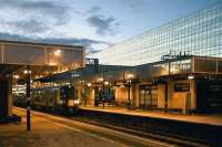 Both the class 350, and 'Stone and Webster House' (the mirror glass block in the background, above the entrance to Milton Keynes station) are acquired tastes. The 350 is about to set off for London on 23 August.<br><br>[Ken Strachan 23/08/2010]