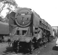 BR Standard class 9F 2-10-0 no 92091 photographed at Carnforth in 1968. As with many locomotives around the end of the steam era, number plate, shed plate etc have been removed and replaced by paint. Following 'official' withdrawal in May 1968, no 92091 was finally cut up at Wards, Beighton, on 30 November, exactly 12 years after it first emerged from Swindon Works.<br><br>[Jim Peebles //1968]