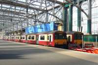 <I>Where is everybody?</I> A pair of 318s standing at 'Inverclyde' platforms 14 and 15 in an unusually quiet Glasgow Central at 09.46 on Thursday 3 June 2010.<br><br>[Colin Miller 03/06/2010]