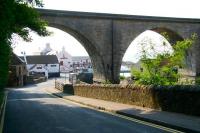 The northern approach to the village of Lower Largo in September 2010 with the old railway viaduct dominating the scene. The white building nearest the camera on the left is the <I>Railway Inn</I> standing at the end of <I>Station Wynd</I>, with the <I>Crusoe Hotel</I> beyond. Part of the harbour can be seen through the arch to the right.<br><br>[John Furnevel 03/09/2010]