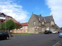 While the former 1847 Newcastle & North Shields Railway terminus at Tynemouth survives in residential use following major refurbishment, the hotel that stood alongside has been demolished and the area has since been redeveloped [see image 21713]. View north west in August 2010.<br><br>[Colin Alexander 18/08/2010]