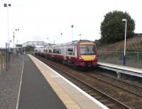 As with Ladybank, the name devised by the Edinburgh & <br>
Northern Railway for its new station gave the name to the settlement, not the other way round.  Cardenden is a former mining village in the parish of Auchterderran, whose church must have been considered too far away to give the station its name.  170 471 pulls away from the staggered platforms with an Inner Circle service for Newcraighall on 4 September.<br>
<br><br>[David Panton 04/09/2010]