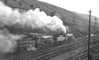 77003+76049 photographed at Tebay on 20 January 1962 having arrived with 1X76 <I>The Stainmore Limited</I>. The 9-coach special had been organised by the RCTS (Darlington & North Eastern Branch) to mark the end of operations over Stainmore and, on its return journey later that day, 1X76 became the last train to traverse the route. [See image 24103] <br><br>[K A Gray 20/01/1962]