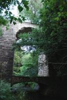 Today it is hard to find any indication that Avoch had a railway connection. The station site is now built over but just east of it, hidden in the undergrowth, is this unusual bridge that once carried the line over the Avoch Burn.<br><br>[John Gray 15/09/2010]