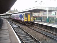 Three hours after leaving Maryport at 0600, Northern 153359 calls right time at Carnforth before its short sprint to Lancaster.The unit will shortly return on a Lancaster to Carlisle service via Barrow and Workington. Behind the platform on the right the WCML runs through the old, cut back, main line platforms            <br><br>[Mark Bartlett 13/09/2010]