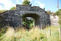 Still standing fifty years after the closure of the Fortrose Branch, a farm access bridge crumbling away in the corner of a fieldwest ofMunlochy in September 2010.<br><br>[John Gray 15/09/2010]