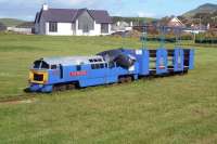 Found behind the Garden Centre in Ballantrae on 16 September 2010. The train stands on a short piece of track, but there are earthworks for an oval around the grassed area. Gauge not measured, I'd guess 10'. <br>
There was a miniature railway on the front at Ayr, closed and dismantled some years ago - presumably that is where this little train came from.<br>
<br><br>[Colin Miller 16/09/2010]