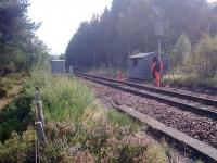 Nearly 9 months after the derailment at Carrbridge [see image 27143], work is still ongoing to replace the cables that were damaged in January. The temporary ones are currently being replaced with fully ducted cables around the station passing loop. Also, the resident's garage that was flattened in the incident has this week been replaced with a<br>
brand new one.<br><br>[Gus Carnegie 17/09/2010]