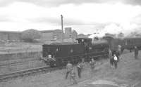 The SLS <I>Glasgow South Railtour</I> shortly after arrival at Giffen behind ex-Caledonian 0-6-0 no 57581 on 9 June 1962. The Royal Navy armament depot stands in the background.<br><br>[K A Gray 09/06/1962]