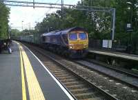 Daytime freight on the WCML tends to run through Northampton to keep the 'main line' clear for Pendos and Voyagers. This is GBRf 66.725 rumbling North on Friday afternoon, 17 September. I saw five freights pass through in a 50 minute extended lunch stop - pretty good free entertainment!<br><br>[Ken Strachan 17/09/2010]