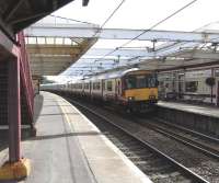 A Glasgow service pulls into Troon on a sunny weekday afternoon on 1 <br>
September. The Class 318 set looks as though it might be stretching all the way back to Ayr, though it is only in fact 6 coaches long (count 'em).<br>
<br><br>[David Panton 01/09/2010]