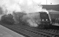 A special from Southampton at Nottingham Victoria on a dismal Saturday 30 March 1963, having brought fans north for the FA Cup quarter final against Forest. <I>West Country</I> Pacific no 34102 <I>Lapford</I> was one of a number of specials to arrive in Nottingham that day. [The result was a 1-1 draw, with Southampton eventually going through 5-0 following a second replay.] [See image 30764]<br><br>[K A Gray 30/03/1963]