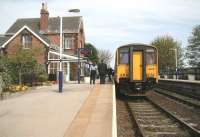 Poppleton part 2. The 13.29 ex-Leeds via Harrogate stands at Poppleton, from where it will continue on the last leg of its journey as the 14.33 service to York. Our station man is currently at the far end of the platform having a quick word with the driver. [See image 30767]<br><br>[John Furnevel 24/04/2009]