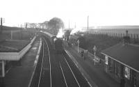 Heaton shed's A3 Pacific no 60073 <I>St Gatien</I> draws the 2.25pm Edinburgh-Newcastle stopping service into Burnmouth on Saturday 27th January 1962. Waiting in the bay is the connecting service for Eyemouth, which was about to commence its final week of operations prior to official closure of the branch on 5 February 1962.<br><br>[Frank Spaven Collection (Courtesy David Spaven) 27/01/1962]