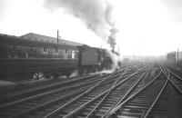 70011 <I>Hotspur</I> takes the up <I>'Thames - Clyde Express'</I> out of Carlisle on 28 December 1963. <br><br>[Robin Barbour Collection (Courtesy Bruce McCartney) 28/12/1963]