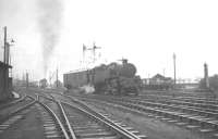 BR Standard class 4 2-6-4T no 80090 shunting a van alongside its home shed of 62B Dundee Tay Bridge (off picture to the left) on 23 November 1963. Meantime a freight is pulling out of the former NB goods yard in the background. Much of this once extensive railway area is now occupied by retail developments, roads, car parks etc.<br><br>[K A Gray 23/11/1963]