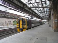 158 869 stands at Perth Platform 5, about to return to Edinburgh on <br>
20 September. It is one of the Alphaline liveried 158s which ScotRail have had on loan for over 3 years now and which add a bit of variety.They have 400hp engines rather than the standard 350hp and sound subtly different. Also sounding different is their digitised on-board safety announcements which are spoken in a mild estuarial whine, rather than the well-spoken but slightly actressy Glaswegian used in all other digitised ScotRail announcements, onboard and in stations. <br>
<br><br>[David Panton 20/09/2010]