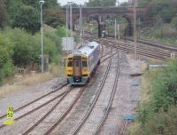 Dropping down from the curve towards the junction, after crossing the WCML, is 158908 on a York to Blackpool service. This view looks north from Flag Lane towards Preston and for a similar view nearly 30 years earlier [see image 19763].<br><br>[Mark Bartlett 13/09/2010]