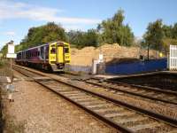 Northern Rail 158853 approaches soon to be removed Woodlesford station foot crossing on the 1037 ex Leeds limited stop service to Sheffield, with preparation work for new footbridge installation visible across the line.<br><br>[David Pesterfield 18/09/2010]