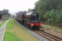 Steam to Blackpool. 5690 <I>Leander</I> hauls the eleven coach <I>Severn Valley Limited</I> through Poulton on its way from Bridgnorth to Blackpool. The train is passing the recently removed section of the island platform and also a long disused section of rail that is a reminder that Poulton once had four tracks.<br><br>[Mark Bartlett 02/10/2010]