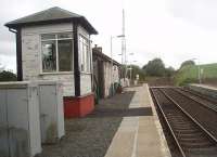 Barrhill looking south and up the gradient to Glenwhilly summit from the Stranraer platform. Three years of weather has taken its toll on the signalbox paintwork since our editor's visit. [See image 15444]<br><br>[Mark Bartlett 18/09/2010]