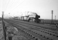 An A3 Pacific passes Drem at speed with an up freight in the 1960s. <br><br>[Robin Barbour Collection (Courtesy Bruce McCartney) //]