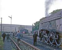 Scene at Riccarton Junction on 5 June 1965 with A4 Pacific no 60027 <I>Merlin</I> at the head of a Scottish Locomotive Preservation Fund special. The train had originated in Edinburgh and travelled via the ECML and the N&C to Carlisle behind A3 no 60052 <I>Prince Palatine</I> [see image 21304].  The A3 had unfortunately failed at Carlisle and 60027 had been hurriedly commandeered to take over for the journey back to Edinburgh via the Waverley route.<br><br>[Bruce McCartney 05/06/1965]