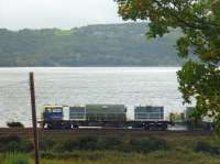 It's back! Autumn is here and my favourite train, the 'Leaf Train' (official name MPV) is back in operation. Here it is on its way back to Glasgow from Helensburgh. Notice the spray coming from the middle section of the train (RHS of photo), presumably to remove fallen leaves from the track (please correct me if anyone knows better!)<br><br>[Beth Crawford 06/10/2010]