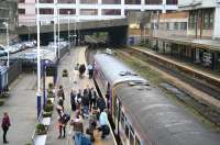 The busy 13.14 service to Leeds boards at Harrogate on 27 September 2010. The 3-car train, consisting of a 153/155 combination, originated from Knaresborough. <br><br>[John Furnevel 27/09/2010]