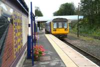 Arrival from the east at Bishop Auckland terminus on 30 September 2010 as the 12.00 Northern DMU from Saltburn runs under Newgate Street Bridge and into the platform. On the right is the former Wearhead branch, a section of which now forms part of the Weardale Railway. [See image 30999]<br><br>[John Furnevel 30/09/2010]