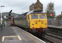 47851 in two tone green leaves Carnforth on the rear of the ecs to <br>
Barnetby on 1 October 2010 in preparation for a railtour the following day. The train is taking the ex MR line to Settle Junction, the ex Furness line is to the left. The lead locomotive is 47500 in WCRC maroon.<br>
<br><br>[John McIntyre 01/10/2010]